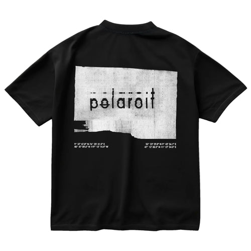 Black oversized 'Polaroit' graphic T-shirt with glitch-style print and coordinates, back view