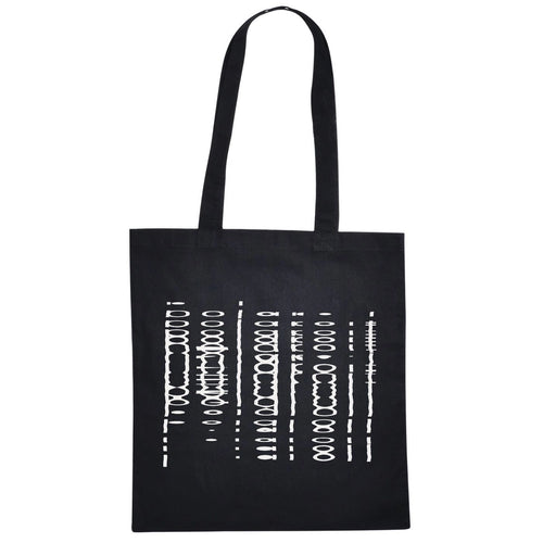 Black tote bag with long handles, featuring an abstract white barcode-style graphic print
